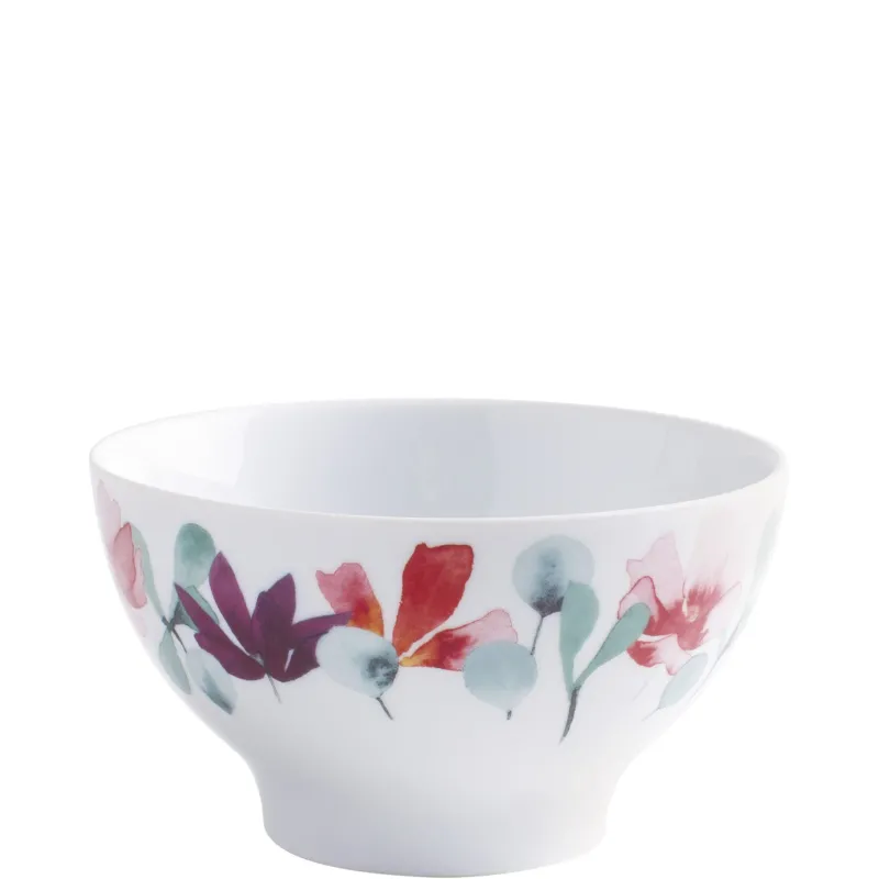 Ein dekorativer, weißer Porzellan-Schüssel mit buntem Blumenmuster in Rosa, Lila und Türkis. Die Schüssel hat einen geschwungenen Rand und eine glatte Innenfläche. Die Außenfläche weist eine Anordnung von floralen Motiven auf, die lebendig und kreativ wirken. Ideal für Servieren von Snacks oder als dekoratives Element.